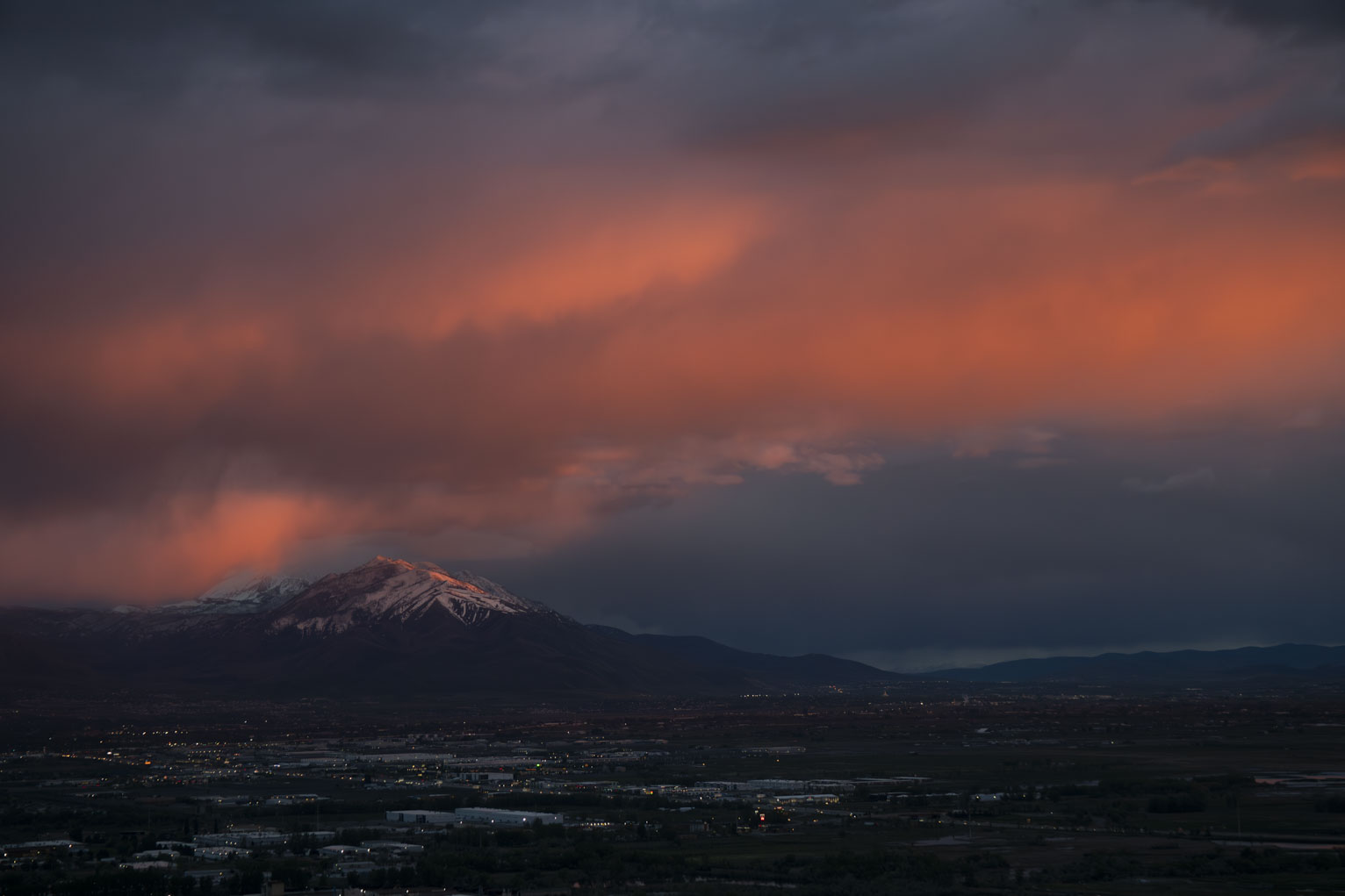 A streak of pinky orange diaganal onto the peak in front of Nebo